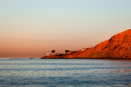 Point Loma lighthouse in San Diego, California at sunset on a clear skyの写真素材