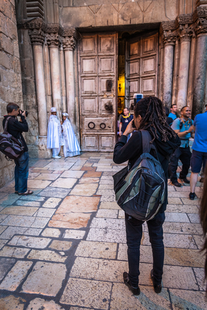 JERUSALEM / ISRAEL - NOVEMBER 19, 2016: Photographers take pictures of a new bride and groom outside Church of the Holy Sepulcre in Jerusalem, Israel.のeditorial素材