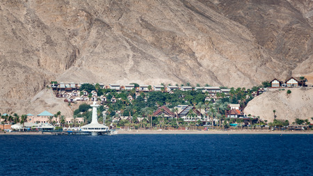 Port of Eilat, Israel marine observatory and aquarium with resort and landscape background.の写真素材