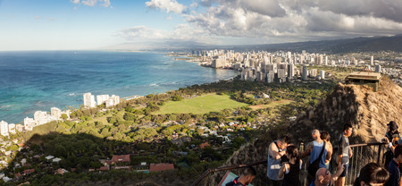 WAIKIKI, HAWAII - SEPTEMBER 17, 2017: Tourist hikers enjoying the view at the top of  Diamond Head National Monument crater hike on Oahu, Hawaii. The location overlooks downtown Honolulu and Waikiki.のeditorial素材
