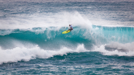 SUNSET BEACH, HAWAII, USA - DECEMBER 2: Surfer competing at the 2017 Vans World Cup of Surfing competition at Sunset Beach on Oahu's scenic North Shore. This is the second of three surfing competitions and Conner Coffin took first place.のeditorial素材