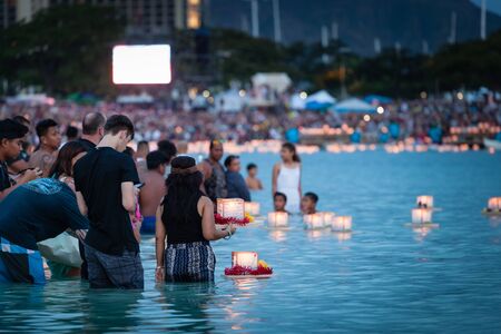 HONOLULU, HAWAII/USA â MAY 28, 2018: Lantern floating ceremony at Ala Moana Beach Park on Magic Island in downtown Honolulu, Oahu, Hawaii, USA. This is an annual Memorial Day event that gathers 50,000 people from around the globe.のeditorial素材