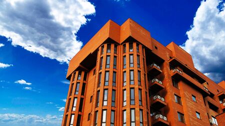 Ukraine Dnieper high-rise building on a background of blue sky with white clouds. Bottom view.の写真素材