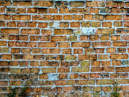 The Brick Wall Of An Old Building. Old brick wall  red color. Great for graffiti inscriptions. Home or office design backdrop.の写真素材