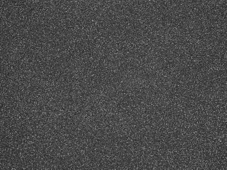 Background of a textured surface of a plastered wall. Black and white photo.の写真素材