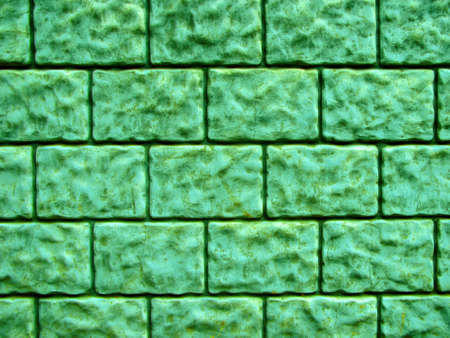 Stone wall background. Decorative stone wall texture. Close-up view of weathered stone wall, grained, natural. Decorative masonry.の写真素材