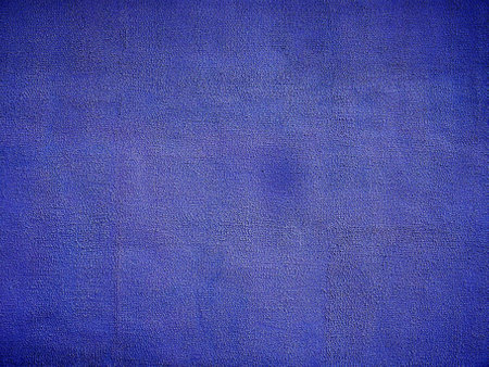 Background from a textured surface blue plastered wall.の写真素材