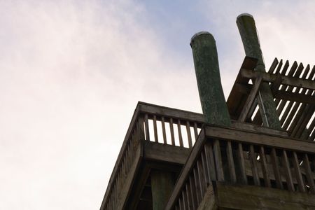 Detail of top two stories of wooden tower 