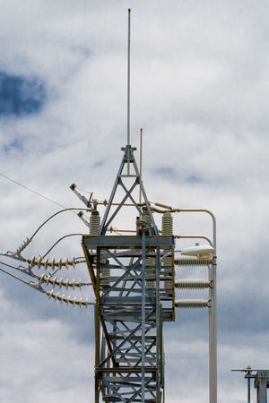 Power transmission tower at a powoer substation with an array of lines