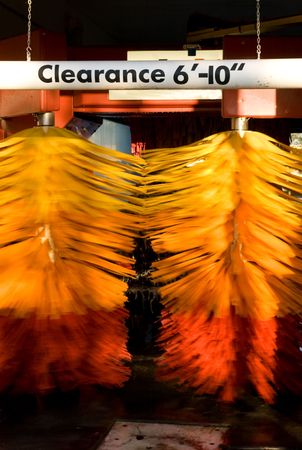 Car wash brushes in action with suds