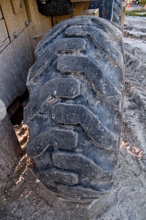 Bulldozer tire on the sand