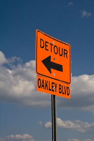 Orand road sign indicating there is a detour aheadの写真素材