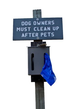 Sign indicating that dog owners must clean up after their animals Isolated on whiteの写真素材