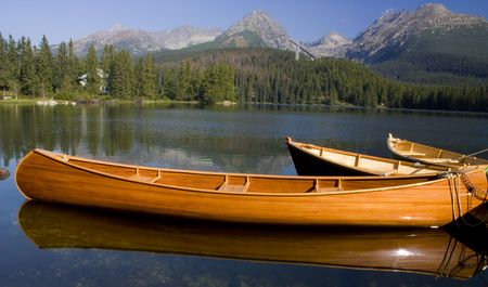 Mountain lake with  boats in National Park High Tatra, Slovakiaの写真素材