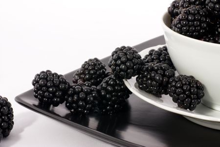 Macro view of fresh ripe blackberries in the bowlの写真素材