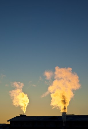 sunrise with a  smoking chimneysの写真素材