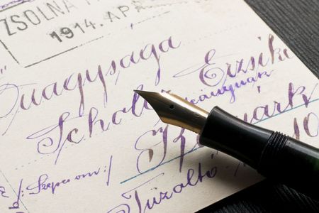 Ancient postcard written by handwriting and an ink featherの写真素材