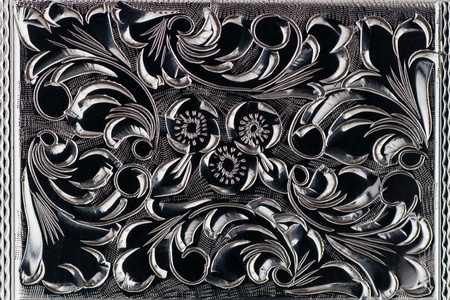 Close up details of engraved  of an old cigarette caseの写真素材