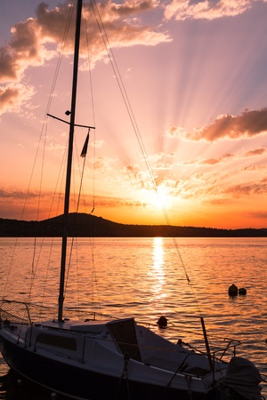 Boat at sunset time, Croatiaの写真素材