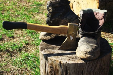  	Dirty boots and axe on hemp