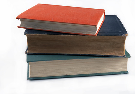 Three old historical books beautiful vintage cover on a white backgroundの写真素材