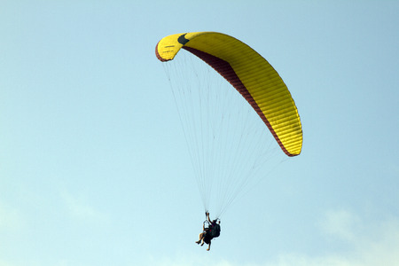 Flying on a parachute India Goa.の写真素材