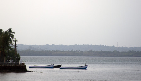 Old fishing boats at sea. India Goa.の写真素材