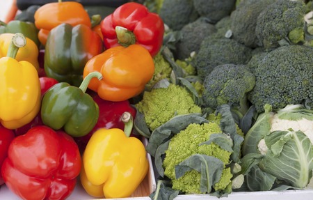 Fresh sweet peppers and Brussels sproutsat the market natural background.の写真素材