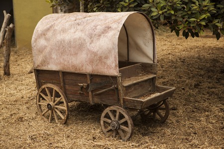 Traditional old American wagon with a roof. Wild west traditonal vintage old wagon  detail.