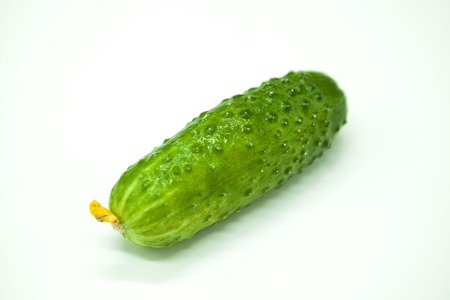 Fresh appetizing tasty cucumber on a white backgroundの写真素材