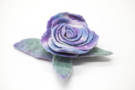 Beautiful blue rose flower milled wool on a white backgroundの写真素材