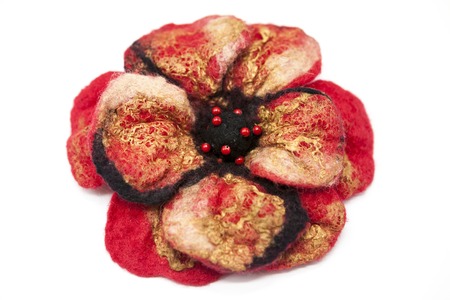Beautiful red rose flower milled wool with beads on a white backgroundの写真素材