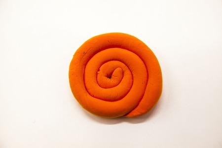 Orange  plasticine Sun on a white background. Weather icon for Internet sites, tablets, phonesの写真素材