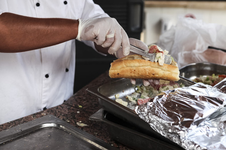 Chef cook prepares tasty meat, chicken hot chili sandwich. chef prepares kebab shavermaの写真素材