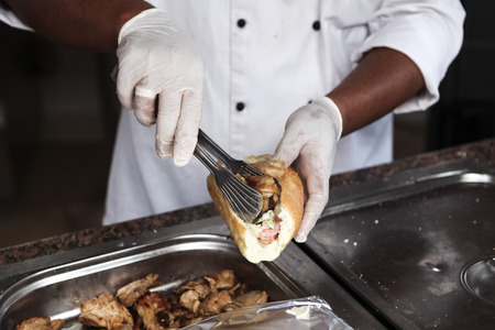Chef cook prepares tasty meat, chicken hot chili sandwich. chef prepares kebab shavermaの写真素材