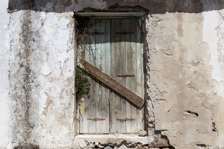 Old door in the stone walls of the village houses. Excellent backgroundの写真素材