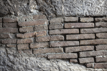 Pattern of the structure of a brick wall with masonry. Old wall European home.の写真素材