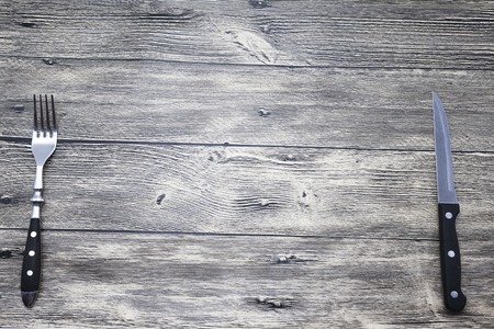 Menu. Good background to create restaurant menus, cafes bars, a wooden table with fork and knife. Can be used for restaurante or bar menu list.の写真素材