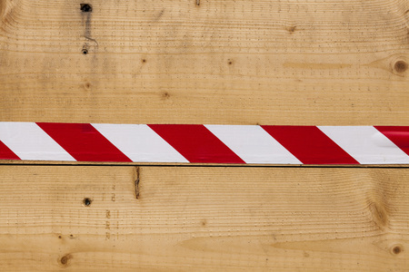 Wooden wall of planks of ash with a bright ribbon red-white. Beautiful texture of the wood pattern. Great background for the production of Wallpaperの写真素材