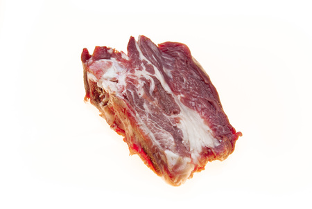 Lamb slices closeup. Australian lamb . Part of the carcass of a sheep saddle on the bone. Fresh meat with streaks of fatの写真素材