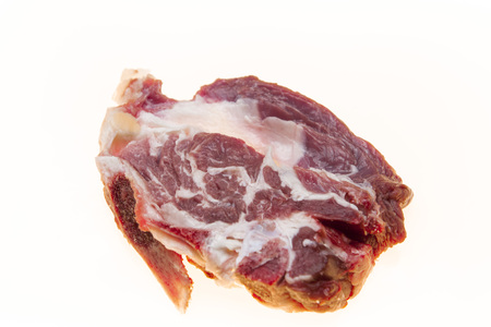Lamb slices closeup. Australian lamb . Part of the carcass of a sheep saddle on the bone. Fresh meat with streaks of fatの写真素材