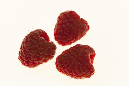 Berries raspberries closeup on a white background