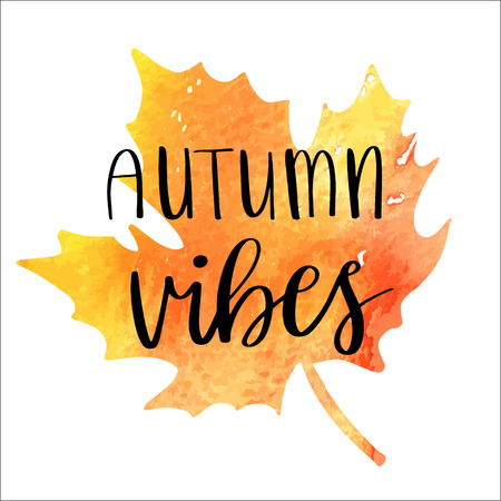 Autumn vibes - hand lettering phrase on orange watercolor maple leaf backgroundのイラスト素材