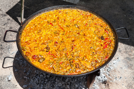 Seafood Paella. The national Spanish dish of paella in a large skillet is cooked on an open fire, at the stake.の写真素材
