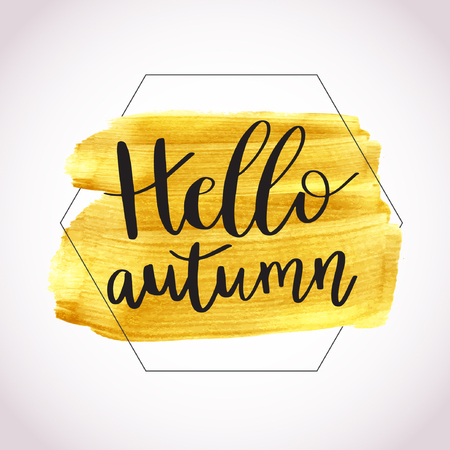 Hello Autumn. Vector illustration of lettering phrase on golden paint stain banner. Vector gold paint. Autumn calligraphy composition with gold brush painted textured stain.のイラスト素材
