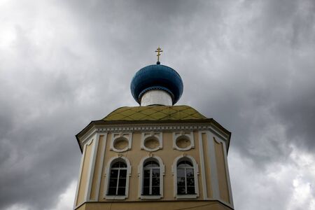 Russian Christian church, a temple on a background of gray sky and cloudsの写真素材
