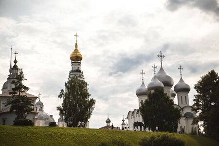 Russian Christian church, a temple on a background of gray sky and clouds