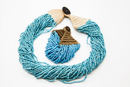 Beautiful beads, necklace made of glass beads, beads on white background. Very sophisticated handmade jewelry.の写真素材