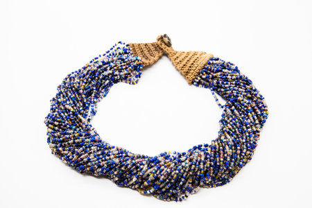 Beautiful beads, necklace made of glass beads, beads on white background. Very sophisticated handmade jewelry.の写真素材