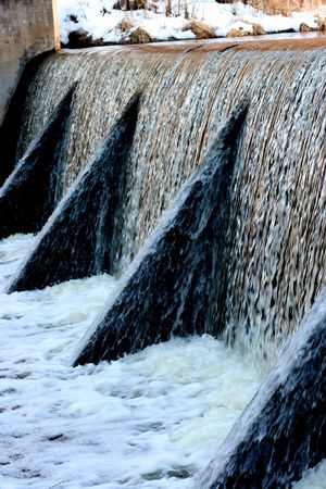 A fast slowing dam during spring meltdown.